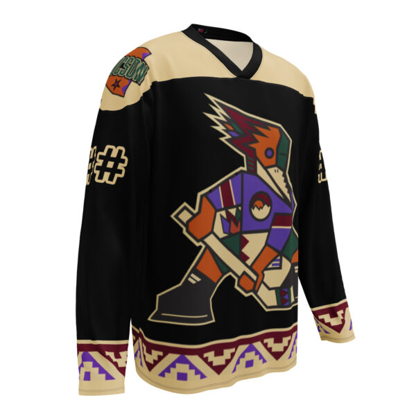 Dark Tucson Junior Roadrunners Kachina fan jersey with black body, sand shoulders, and Southwest trim, front view