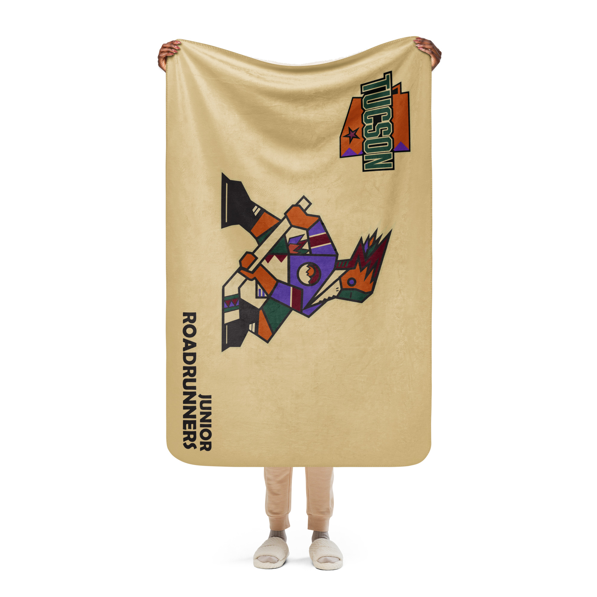 Person holding the 37 x 57 Tucson Junior Roadrunners sand Kachina sherpa blanket