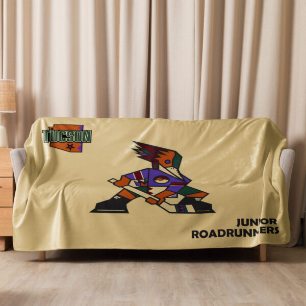 Sand Tucson Junior Roadrunners Kachina sherpa blanket draped over a couch in the 60 x 80 size
